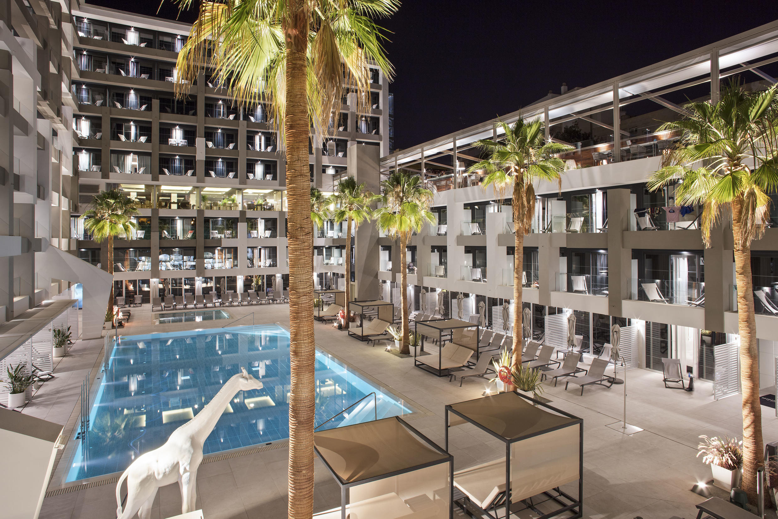 02dInnsidePalmaBosque-Facade_In_Pool_Night.jpg